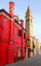 Red fire house and bell tower in Burano Venice area Italy Royalty Free Stock Photo