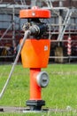 Red fire hydrant with fire hose