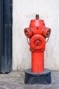 Red fire hydrant on a paved sidewalk Royalty Free Stock Photo