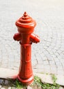 Red fire hydrant in the street Royalty Free Stock Photo