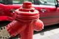 Red fire hydrant water pipe near the road. Fire hydrant for emergency fire access Royalty Free Stock Photo