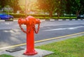 Red fire hydrant water pipe near the road.