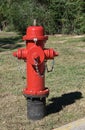 Red fire hydrant water supply fireplug on lawn. Royalty Free Stock Photo