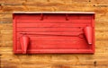 Red fire point stand mounted on wooden wall