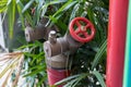 Red fire pump in front of concrete wall. fire safety pump on cement floor of concrete building. Deluge system of firefighting syst