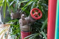 Red fire pump in front of concrete wall. fire safety pump on cement floor of concrete building. Deluge system of firefighting syst