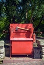 Red fire shield. Equipment for extinguishing fires. Cone buckets, hook, axe, box with sand, fire extinguisher. Street trash can. Royalty Free Stock Photo