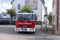 red fire truck driving city streets to extinguish fire, Emergency Situations, fire fighting and community assistance, Karlsdorf,