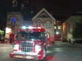 Red fire truck in front of a fire station in Toronto at night Royalty Free Stock Photo