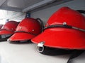 Red fireman helmet prepared on shelf