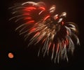 Red fireworks background, Malta, dark sky background and house light in the far, Independence day, fireworks Royalty Free Stock Photo