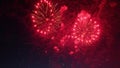 Red fireworks exploding in the night sky creating a beautiful show Royalty Free Stock Photo