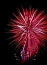 Red fireworks like star with city hall clock Royalty Free Stock Photo