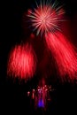Red fireworks in Ostrava with city hall clock Royalty Free Stock Photo