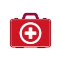 Red first aid kit isolated on gray background. Medical box with white cross like a diagnostics concept.