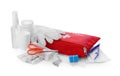 Red first aid kit, scissors, pins, gloves, cotton buds, pills, hand sanitizer, plastic forceps and elastic bandage isolated on Royalty Free Stock Photo