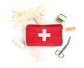 Red first aid medical kit bag with scissors, tape and gloves top view flat lay from above over white Royalty Free Stock Photo