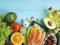 Red fish, avocado nutrition composition selection healthy food on a blue wooden background Royalty Free Stock Photo