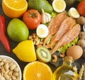 Red fish, avocado, kiwi nuts salad assortment on a black wooden background, healthy food Royalty Free Stock Photo