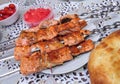 Red fish fried on skewers Royalty Free Stock Photo