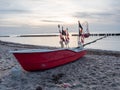 Red fishing boat lying on beach of the Ruegen island at Dranske village Royalty Free Stock Photo