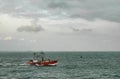 Red fishing boat in paranagua harbour brasil