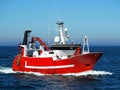 Red Fishing Boat Underway at Sea. Royalty Free Stock Photo
