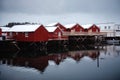 Red fishing houses near lake on Lofoten island Royalty Free Stock Photo