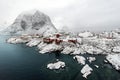 Red fishing hut (rorbu) on the Hamnoy island in winter, Reine, L Royalty Free Stock Photo