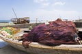 Red fishing nets on a wooden boat Royalty Free Stock Photo