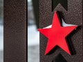The red five-pointed metal star is a symbol of the Soviet Union and the Soviet Army, a close-up Soviet star Royalty Free Stock Photo