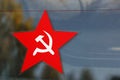 Red five-pointed star with sickle and hammer emblem