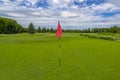 Red flag at beautiful golf course in green park at Mezhgorye residence, Ukraine Royalty Free Stock Photo