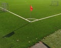 Red flag on the corner of a football field. Place for a corner kick on a soccer ball Royalty Free Stock Photo