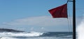 Red flag danger big waves Royalty Free Stock Photo