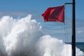 Red flag danger big waves Royalty Free Stock Photo