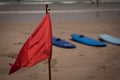 Red flag flap on the beach