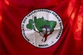 Red flag of the landless rural workers movement. write in portuguese on flag. Brazil