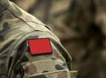 Red flag on military uniform. Red flag one of the first anarchist symbols. Anarchism Red flag