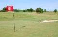 Red flag number eight on golf course Royalty Free Stock Photo