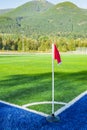 A Red flag at one corner of football stadium and soccer corner of a soccer field. Football field with the corner flag Royalty Free Stock Photo