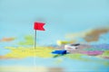 Red flag, pushpin, thumbtack pinned on map of europe. Copy space, travel concept