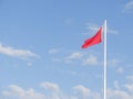 Red flag for rough sea over a lifeguard tower long an Italian be Royalty Free Stock Photo