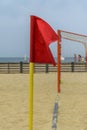 Red flag signaling a corner of a beach soccer field Royalty Free Stock Photo