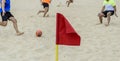 Red flag signaling a corner of a beach soccer field Royalty Free Stock Photo