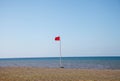 Red flag warning on beach in Spain Royalty Free Stock Photo