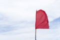 Red flag warning flags danger wind blue sky background Royalty Free Stock Photo