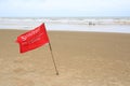 Red flag Warning Strong Current and Dangerous No Swimming in sea on Storm. Red flag flying on beach Royalty Free Stock Photo
