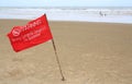 Red flag Warning Strong Current and Dangerous No Swimming in sea on Storm. Red flag flying on beach Royalty Free Stock Photo