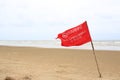 Red flag Warning Strong Current and Dangerous No Swimming in sea on Storm. Red flag flying on beach Royalty Free Stock Photo